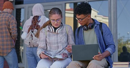 Poster - College, students and friends with laptop and notes on campus for education, knowledge or learning. University, man and woman with discussion for scholarship opportunity, lecture or class together