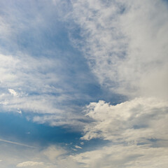 Wall Mural - beautiful cirrus clouds on a bright sunny day against the sky.