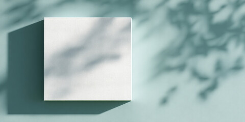 Poster - White textured canvas mockup on teal background, showcasing leaf shadows, ideal for branding or design projects, provides free space for text or image