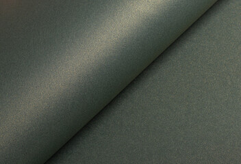 Fototapete - Paper texture with warm yellowish tone, glossy surface and pearlescent shimmer, stylish designer paper rolled with moss green and olive green layers, elegant minimalistic composition..