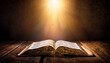 © Caden - shining holy bible ancient book on old table
