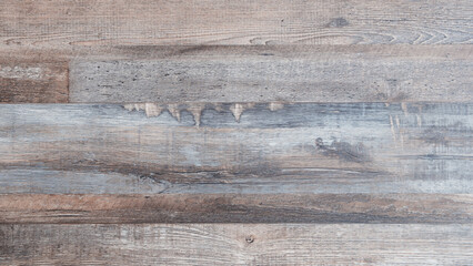 Aufkleber - A wooden floor texture background with a grainy texture. The wood is brown and has a natural look. The floor is made of wood and has a rustic feel to it
