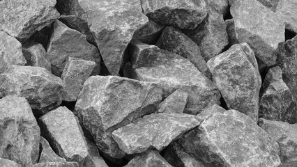 Aufkleber - A pile of gray rocks with a rough texture. The rocks are piled up in a way that they form a wall. Concept of ruggedness and strength, as the rocks seem to be unyielding and solid