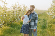© Alexandr - Spring Romance A Young Couple Hugging in the Countryside