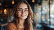 © Daisha - Portrait of a naturally beautiful woman smiling with glasses at coffee shop