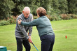 © Dean2000/peopleimages.com - Sports, golf and senior man with help for game, competition and practice on golfing course. Fitness coach, retirement and people with club for training, match and exercise with personal trainer