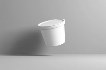 Poster - Floating white container against a gray background with soft lighting and shadows that emphasize its shape and texture