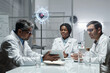 © pressmaster - Group of scientists in lab coats collaborating around a table, sharing ideas and data on a digital tablet with holographic virus model in background
