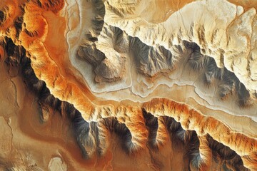 Aufkleber - Aerial view of a desert landscape showcasing intricate, colorful canyons and rugged mountain formations.