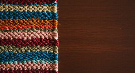 Aufkleber - A colorful crochet blanket with a wooden background