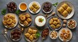 © Hariyanto Bromantio - Middle Eastern desserts assortment featuring baklava, dates, and nuts on gray surface