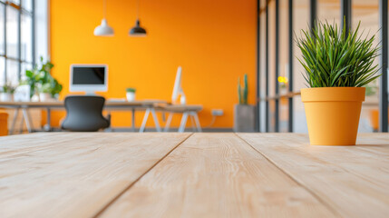 Poster - Modern office interior with vibrant orange wall, wooden flooring, and potted plant, creating fresh and inviting atmosphere