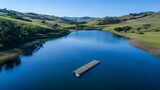 Serene Lake Landscape: Stunning Aerial View of Tranquil Waters and Rolling Green Hills