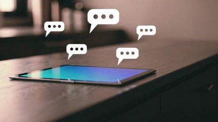 Poster - Digital tablet displaying floating chat bubbles, illustrating social media interaction within minimalist home environment, symbolizing contemporary digital communication