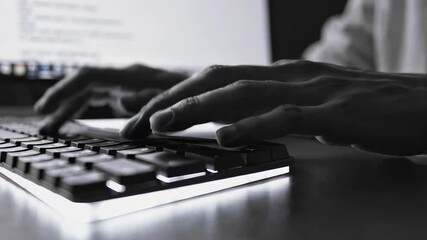 Aufkleber - Close up montage showcases programmer's hands rapidly typing code on an illuminated keyboard, highlighting the dynamic and fast paced nature of software development