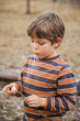 © Austockphoto - Young boy eating a toasted marshmallow from a stick