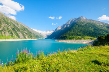 Wall Mural - azure lake and high mountain range in austria. mountain landscapes during summer. warm sunny weather