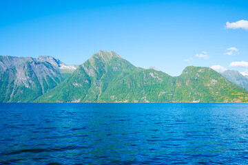 Wall Mural - nature in fjords. norway. high mountains and reflections on the surface of the water. place for moun