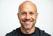 © iushakovsky - Portrait of a bald man with a warm and friendly smile