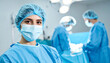 © hardvicore - Surgeon woman in protective mask standing in operating theater performing surgery. Professional