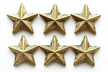 Arrangement of six golden star shaped objects on a white surface in a two row formation