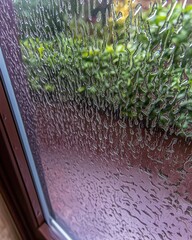Poster - A beautifully captured window with water droplets creating a stunning visual effect and atmosphere