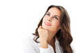 © vgstudio - Portrait image - young cute brunette businesswoman woman with wavy brown hair wear shirt rests her chin on her hand, gazing looking thoughtfully up upward, isolated against white background