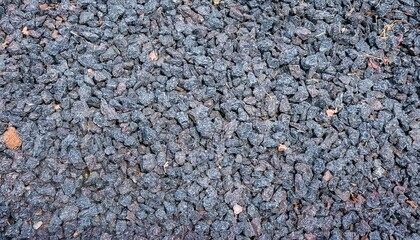 Poster - dark crushed gravel stones texture for backgrounds, web design, print media, construction branding, rugged surface graphic resource in high resolution

