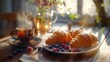 © Thirawat - peaceful breakfast table with steaming coffee and croissants, enhanced with a drizzle of honey and a scattering of berries