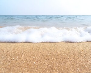 Wall Mural - gentle ocean waves lapping on a sandy beach