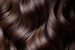 © Veronika - Close up of brown hair with subtle highlights, styled elegantly cascading over a textured fabric background.