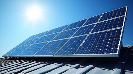 solar panel installation on roof with blue sky and sun in background.