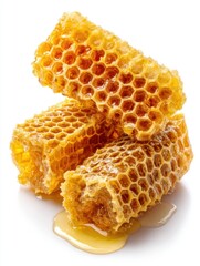 Poster - Golden honeycomb pieces stacked with dripping honey a natural sweetener on white background sweet treat from bees healthy food close up studio shot
