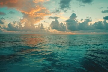 Poster - Sunset clouds reflect over the Indian Ocean as the camera moves closer to the horizon, Maldivian island in Indian ocean, camera moving over water towards sunset clouds and the sun