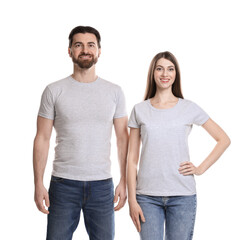 Wall Mural - woman and man wearing blank t-shirts on white background. mockup for design