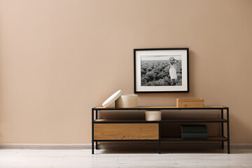 Aufkleber - Console table and decor near dark beige wall in room, space for text. Interior design