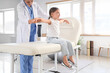 © Pixel-Shot - Female osteopath working with little patient in clinic