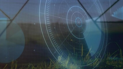 Poster - Wind turbine tower spinning in field while flat design digital gauges and charts overlaying scene