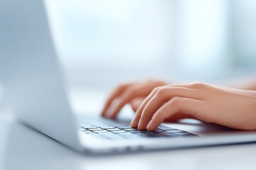 Poster - close-up of student hands typing on laptop keyboard in bright minimalistic workspace with ample natu