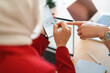 © Studio Marmellata - Two colleagues are collaborating on a project. They are using a tablet and stylus to review data, likely to improve efficiency.