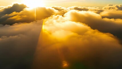 Wall Mural - Sun rays pierce through a mix of sun and clouds