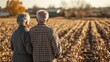 © Albert Kazakh - An elderly couple stands together, gazing at their barren fields devastated by drought. The dry soil and lifeless crops illustrate the harsh realities of climate impact on farming