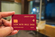 © Said21 Photography  - Man's hand holding a red credit card. Finance and banking concept, Finance, investment, online payment, online shopping, savings
