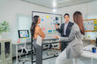© Tj - Business team discussing and brainstorming, analyzing sales data charts using whiteboard, sharing opinions and analyzing company marketing strategy planning in modern office
