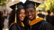 © Chayanan - Happy African American Graduates in Cap and Gown Celebrating Together in Portrait