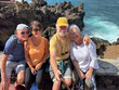 © luciano - Four cheerful seniors along the sea coast looking at phone for selfie - Group of smiling pensioners enjoying nature and taking a walk together on a sunny day