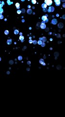 Wall Mural - blue flow from big shiny blue particles, direction to bottom, loop transparent video, vertical social media motion background