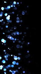Wall Mural - blue flow from big shiny blue particles, direction to right, loop transparent video, vertical social media motion background