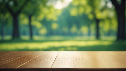 Poster - An empty wood table set against a defocused backdrop of sunlit garden trees for product presentation.