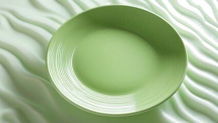 Poster - Green plate with a wave texture, Empty plate with wavy pattern against a white surface